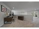 This loft space features a desk, neutral carpet, and bright natural light perfect for your home office or bonus area at 1366 Killington Ct, Evergreen, CO 80439