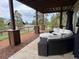 Covered patio with comfortable seating, providing a relaxing outdoor living space at 1366 Killington Ct, Evergreen, CO 80439