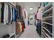 Well-organized walk-in closet with custom shelving and ample storage space for clothes and shoes at 1366 Killington Ct, Evergreen, CO 80439