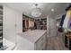 Large walk-in closet featuring an island with marble countertop, custom shelving, and ample storage space at 1366 Killington Ct, Evergreen, CO 80439