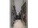 This custom wine cellar has lots of storage and a light-colored tile floor at 1366 Killington Ct, Evergreen, CO 80439