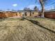 Spacious backyard with a well-maintained lawn and a brick patio with a small garden area at 1479 S Bellaire St, Denver, CO 80222