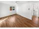 Bright bedroom with wood floors and a door to an ensuite bathroom at 1479 S Bellaire St, Denver, CO 80222