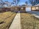 Charming brick home featuring an attached garage, neutral colors, and a well-kept front yard at 1479 S Bellaire St, Denver, CO 80222