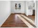 Living room features hardwood floors and glass doors that provide lots of natural light at 1479 S Bellaire St, Denver, CO 80222