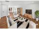 Bright living room with contemporary decor, hardwood floors, and a large, decorative striped rug at 1479 S Bellaire St, Denver, CO 80222