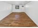 Living room with hardwood floors and a large window for natural light at 1479 S Bellaire St, Denver, CO 80222