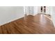 Open-concept living space with hardwood floors, white walls, and a modern design at 1479 S Bellaire St, Denver, CO 80222