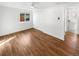 Unfurnished main bedroom featuring hardwood floors, a ceiling fan, and natural light from the backyard view at 1479 S Bellaire St, Denver, CO 80222