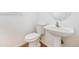 Clean, modern half-bathroom with pedestal sink at 4579 S Jebel Ct, Centennial, CO 80015