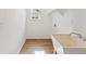 A minimalist laundry room with a utility sink and neutral flooring at 4579 S Jebel Ct, Centennial, CO 80015