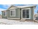 Back of the house with sliding glass door access to backyard at 1595 Orchard St, Brighton, CO 80601
