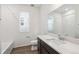 Bright bathroom featuring a shower-tub combo, spacious vanity, and modern fixtures at 1595 Orchard St, Brighton, CO 80601