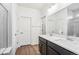 Bathroom with dual vanity, large mirror, and walk-in shower at 1595 Orchard St, Brighton, CO 80601
