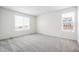 Bright room offers two windows, neutral carpet, and ample space at 1595 Orchard St, Brighton, CO 80601