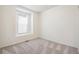 Neutral bedroom with plush carpet and natural light from a window at 1595 Orchard St, Brighton, CO 80601