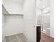 Walk-in closet offering built-in storage options and an attached bath with walk-in shower at 1595 Orchard St, Brighton, CO 80601