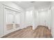 Bright entryway boasts wood-look floors, a closet, and a glass-door den for a welcoming ambiance at 1595 Orchard St, Brighton, CO 80601