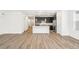 Modern kitchen featuring dark cabinetry, stainless steel appliances, and island at 1595 Orchard St, Brighton, CO 80601