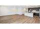 Bright, open layout with modern kitchen, stainless steel appliances, and island at 1595 Orchard St, Brighton, CO 80601