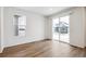 Bright living room features wood-look floors, and a large sliding glass door at 1595 Orchard St, Brighton, CO 80601