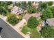 Aerial view of home featuring a long driveway, mature trees, manicured lawn, and fenced backyard at 20855 E Lyttle Dr, Parker, CO 80138