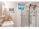 Modern bathroom showcasing a glass-enclosed shower, vanity with a sink, and decorative art at 20855 E Lyttle Dr, Parker, CO 80138