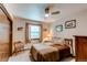 Cozy bedroom with a ceiling fan, a comfortable bed with pillows, and decoratively framed prints adding warmth and character at 20855 E Lyttle Dr, Parker, CO 80138