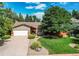 Charming single-story home with a well-manicured lawn and mature landscaping at 20855 E Lyttle Dr, Parker, CO 80138
