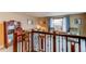 Second floor landing view of the living room with neutral colors and natural light at 20855 E Lyttle Dr, Parker, CO 80138