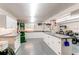 Bright and spacious workshop featuring ample counter space, storage cabinets, and heavy-duty equipment at 20855 E Lyttle Dr, Parker, CO 80138