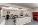 Workshop with spacious work area, storage cabinets, and a variety of tools and equipment at 20855 E Lyttle Dr, Parker, CO 80138