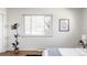 Bright bedroom featuring a large window and minimalist décor at 3520 Miller St, Wheat Ridge, CO 80033
