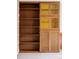 Built-in shelving unit showcasing a combination of open shelves and cabinets with decorative glass panels at 3520 Miller St, Wheat Ridge, CO 80033