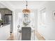 Bright dining room with modern table set and stylish pendant lighting at 3520 Miller St, Wheat Ridge, CO 80033