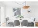 Dining area bathed in natural light with a stylish table and comfortable seating at 3520 Miller St, Wheat Ridge, CO 80033