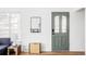 Bright entryway features a decorative front door and a stylish mirror at 3520 Miller St, Wheat Ridge, CO 80033