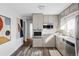 Updated kitchen features stainless appliances, natural light, and sleek countertops at 3520 Miller St, Wheat Ridge, CO 80033