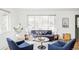 Bright living room featuring stylish decor, ample seating, and large windows at 3520 Miller St, Wheat Ridge, CO 80033