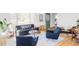 Sun-filled living room with modern furniture, hardwood floors, and large windows at 3520 Miller St, Wheat Ridge, CO 80033