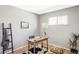 Bright office space featuring hardwood floors, a vintage desk, and natural light at 3520 Miller St, Wheat Ridge, CO 80033