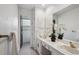 Bright bathroom with double sinks, a large mirror, and pristine white decor offering a clean and relaxing space at 5196 S Williams Dr, Greenwood Village, CO 80121