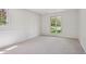 This bedroom is carpeted, and has white walls and trim at 5196 S Williams Dr, Greenwood Village, CO 80121