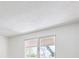 This bedroom has a window with light filtering in at 5196 S Williams Dr, Greenwood Village, CO 80121