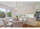 Eat-in kitchen dining area showcasing a modern light fixture and a window with a verdant view at 5196 S Williams Dr, Greenwood Village, CO 80121