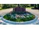 Welcome to Greenwood Pines, as displayed on the beautiful brick entrance sign with lush landscaping at 5196 S Williams Dr, Greenwood Village, CO 80121