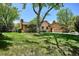 Exterior of home surrounded by lawn and trees at 5196 S Williams Dr, Greenwood Village, CO 80121