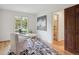 Bright home office with a view, modern decor, and easy access to an adjacent bathroom at 5196 S Williams Dr, Greenwood Village, CO 80121