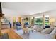 Elegant living room with French doors leading to a beautiful backyard, perfect for entertaining at 5196 S Williams Dr, Greenwood Village, CO 80121