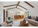 Comfortable living room with hardwood floors, beamed ceiling, and stylish decor, perfect for relaxing and entertaining at 5196 S Williams Dr, Greenwood Village, CO 80121
